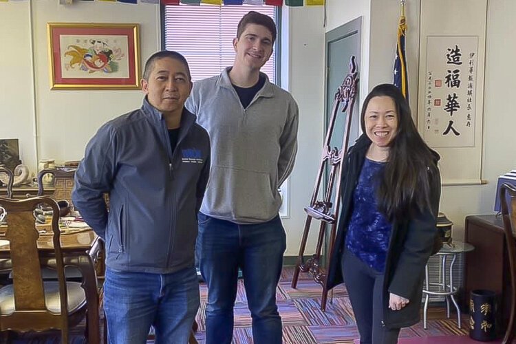 Johnny Wu, Nick Muhlbach, and Lisa Wong at the Erie Chinese Journal offices
